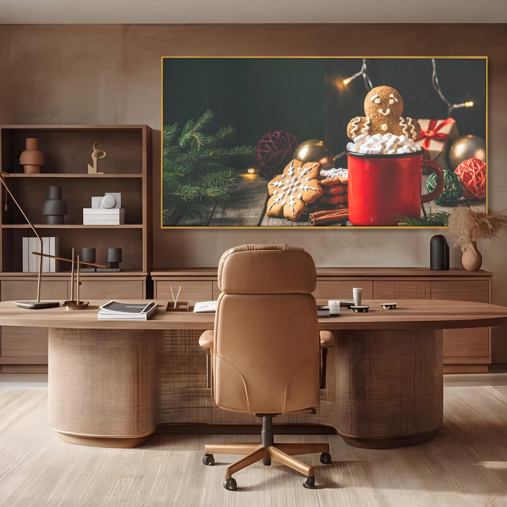 Tablou canvas cu tablou canvas cu turta dulce si cana rosie, in rama de aluminiu auriu, pe perete intr-un birou