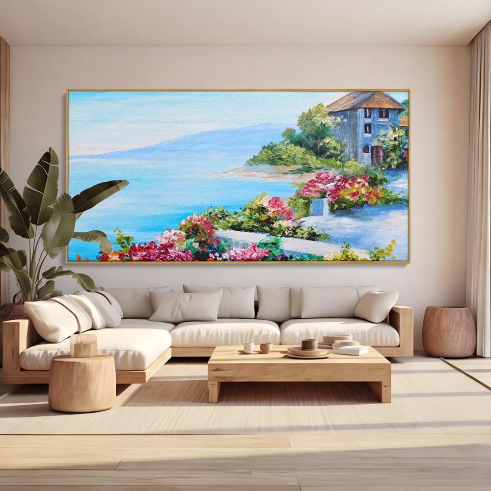 Tablou canvas cu tablou pictura cu flori si mare, in rama de aluminiu auriu, pe perete intr-un living