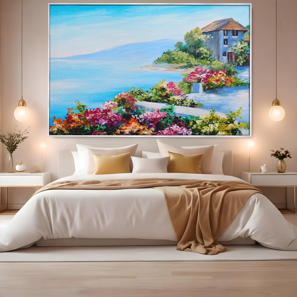 Tablou canvas cu tablou pictura cu flori si mare, in rama de aluminiu argintiu, pe perete intr-un dormitor