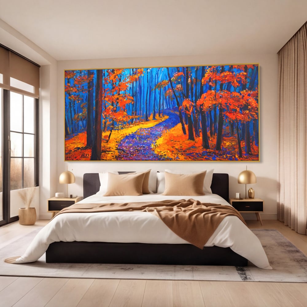 Tablou canvas cu pictura cu padure de toamna si poteca, in rama de aluminiu auriu, pe perete intr-un dormitor