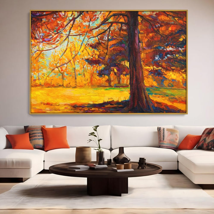 Tablou canvas cu pictura in ulei cu padure de toamna, in rama de aluminiu auriu, pe perete intr-un living