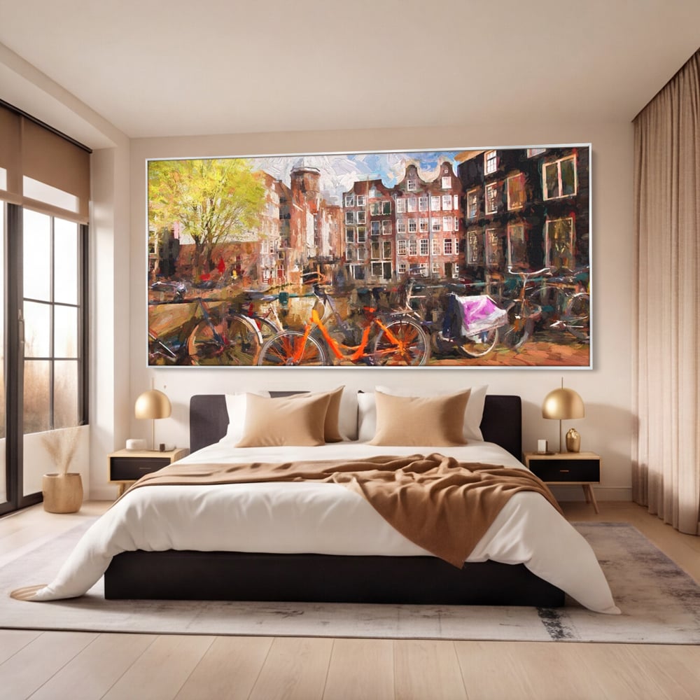 Tablou canvas cu tablou canvas cu bicicleta portocalie pe malul canalului, in rama de aluminiu argintiu, pe perete intr-un dormitor