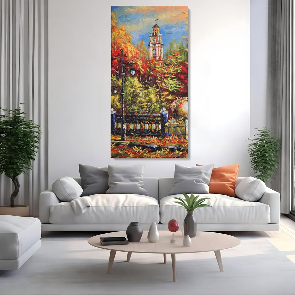 Tablou canvas cu pictura cu peisaj de toamna si turn cu ceas, fara rama, pe sasiu de lemn, pe perete intr-un living