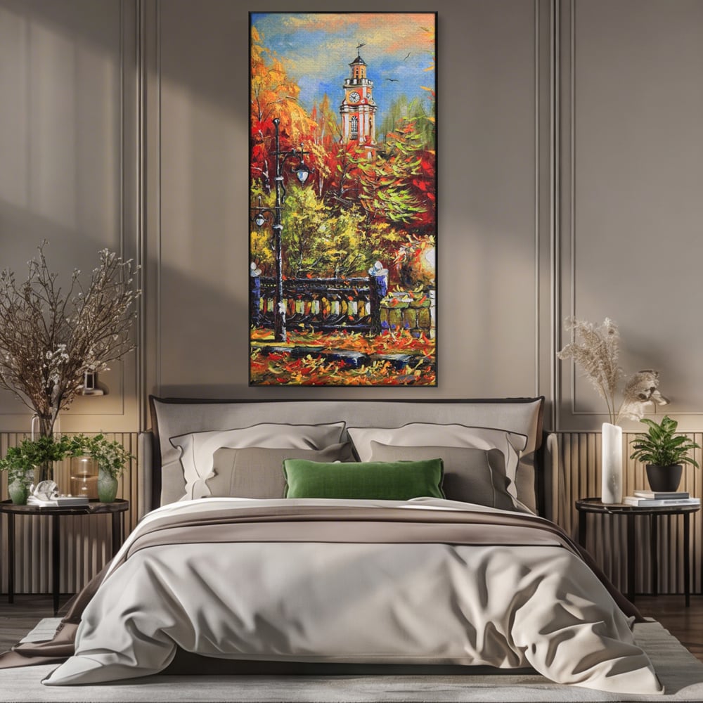 Tablou canvas cu pictura cu peisaj de toamna si turn cu ceas, in rama de aluminiu negru, pe perete intr-un dormitor