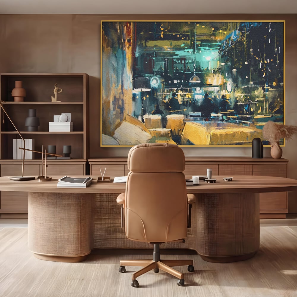 Tablou canvas cu pictura cu cafenea nocturna si lumini, in rama de aluminiu auriu, pe perete intr-un birou