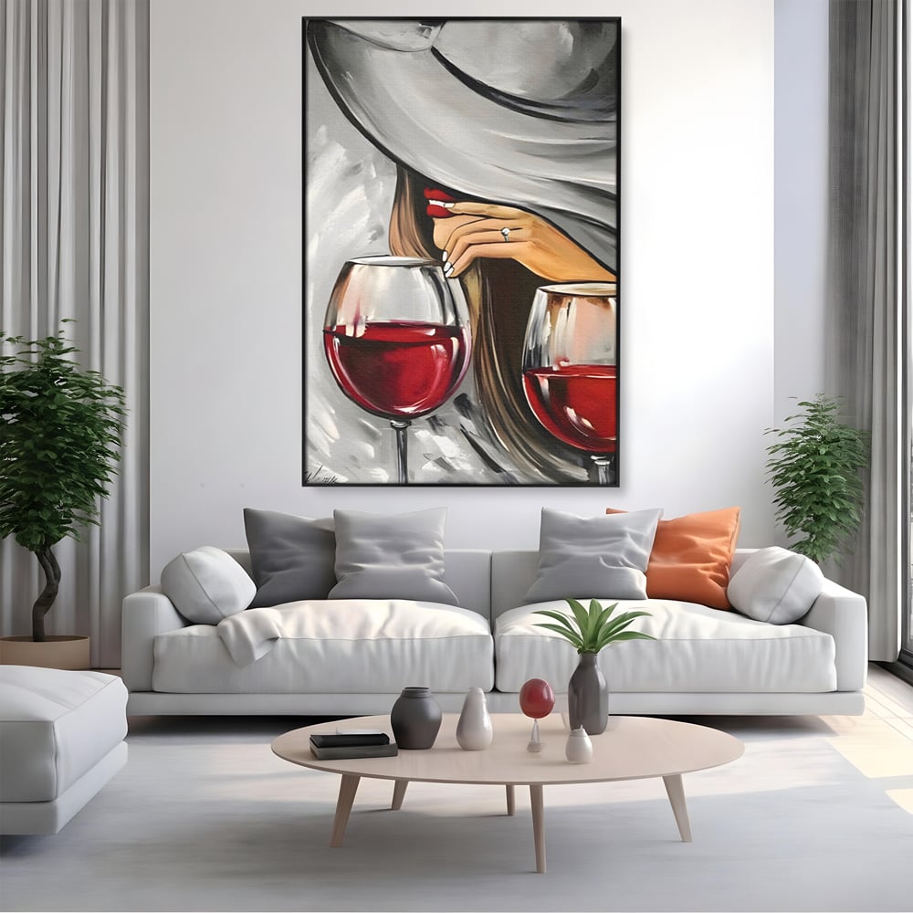Tablou canvas cu tablou canvas cu femeie si vin rosu, in rama de aluminiu negru, pe perete intr-un living
