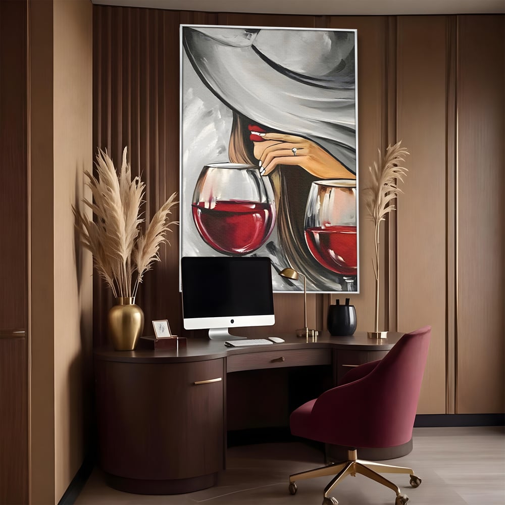 Tablou canvas cu tablou canvas cu femeie si vin rosu, in rama de aluminiu argintiu, pe perete intr-un birou