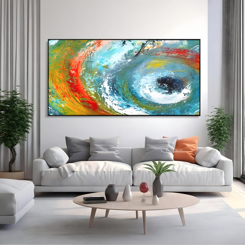 Tablou canvas cu pictura abstracta cu vartej de culori, in rama de aluminiu negru, pe perete intr-un living