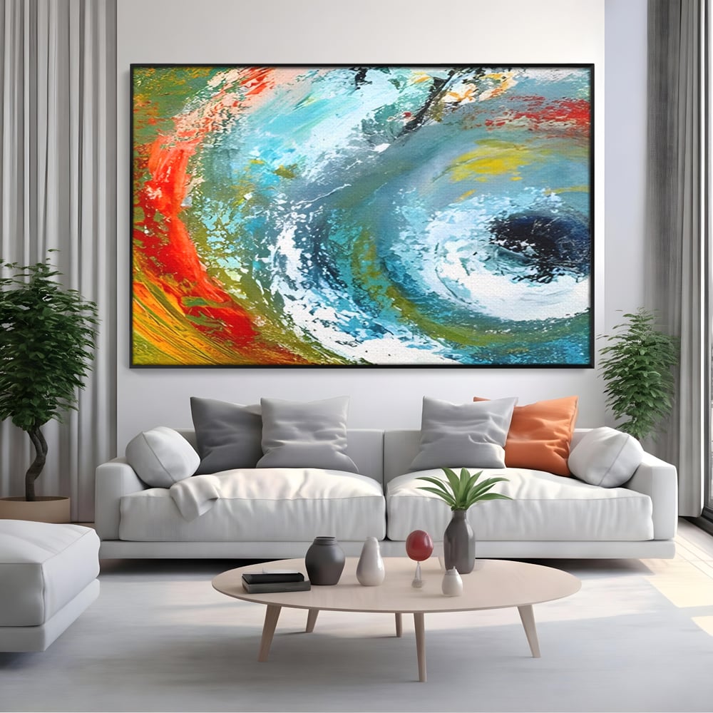Tablou canvas cu pictura abstracta cu vartej de culori, in rama de aluminiu negru, pe perete intr-un living
