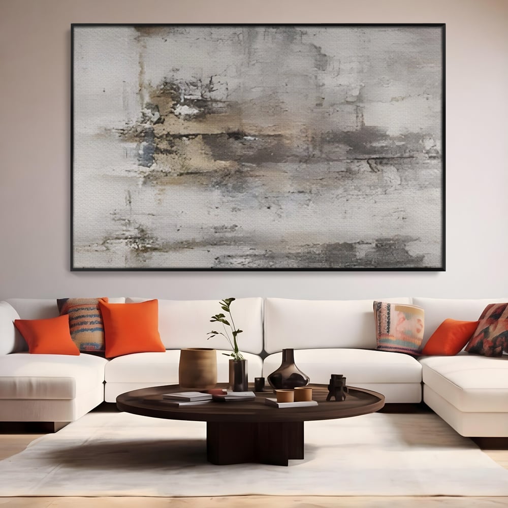 Tablou canvas cu pictura abstracta cu texturi gri si bronz, in rama de aluminiu negru, pe perete intr-un living