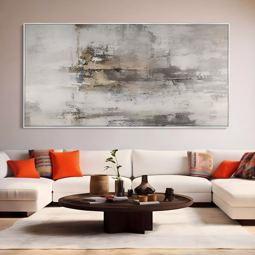 Tablou canvas cu pictura abstracta cu texturi gri si bronz, in rama de aluminiu argintiu, pe perete intr-un living