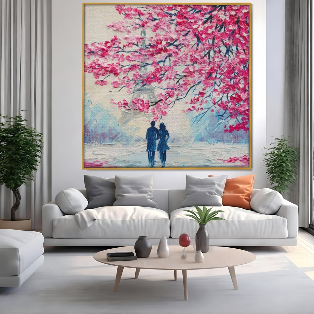 Tablou canvas cu tablou patrat cuplu sub pom roz, in rama de aluminiu auriu, pe perete intr-un living