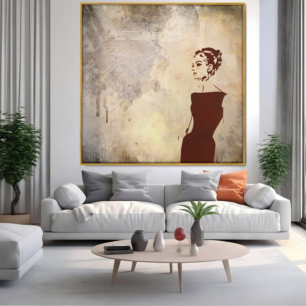 Tablou canvas cu ilustratie cu o femeie in rochie, in rama de aluminiu auriu, pe perete intr-un living