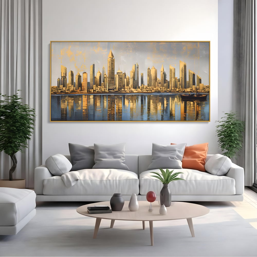 Tablou canvas cu tablou canvas cu peisaj urban si cladiri inalte, in rama de aluminiu auriu, pe perete intr-un living