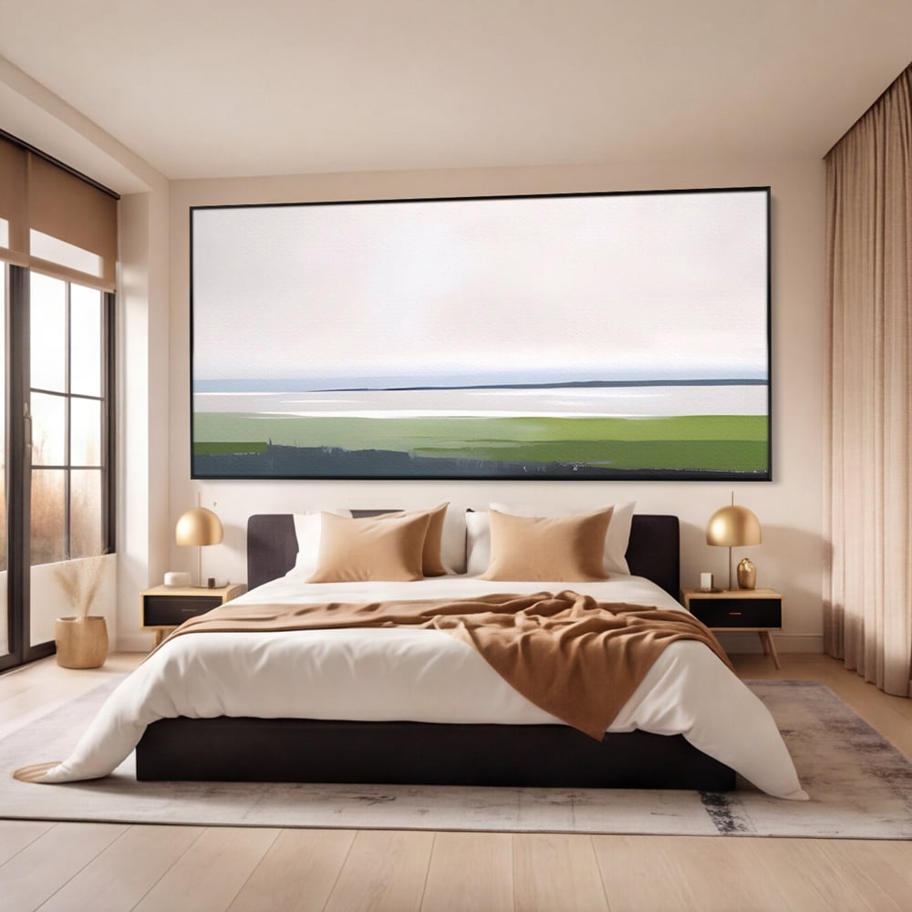 Tablou canvas cu pictura orizontala cu peisaj de campie si apa, in rama de aluminiu negru, pe perete intr-un dormitor