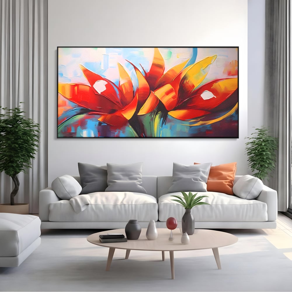 Tablou canvas cu pictura abstracta cu flori portocalii, in rama de aluminiu negru, pe perete intr-un living