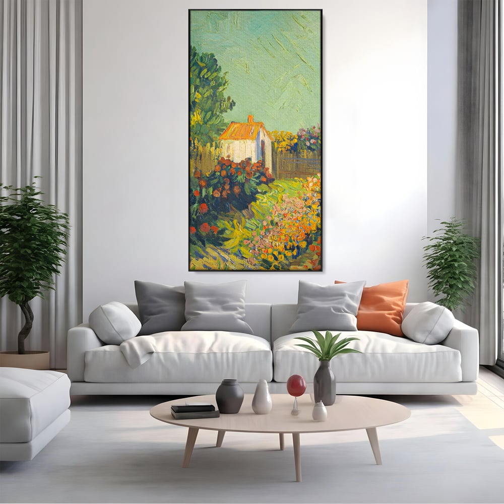 Tablou canvas cu pictura cu o casuta in gradina, in rama de aluminiu negru, pe perete intr-un living