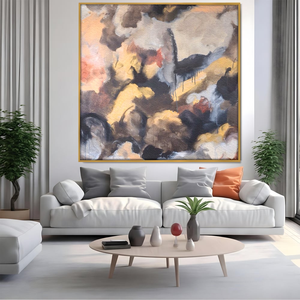 Tablou canvas cu pictura abstracta cu pete de culoare, in rama de aluminiu auriu, pe perete intr-un living
