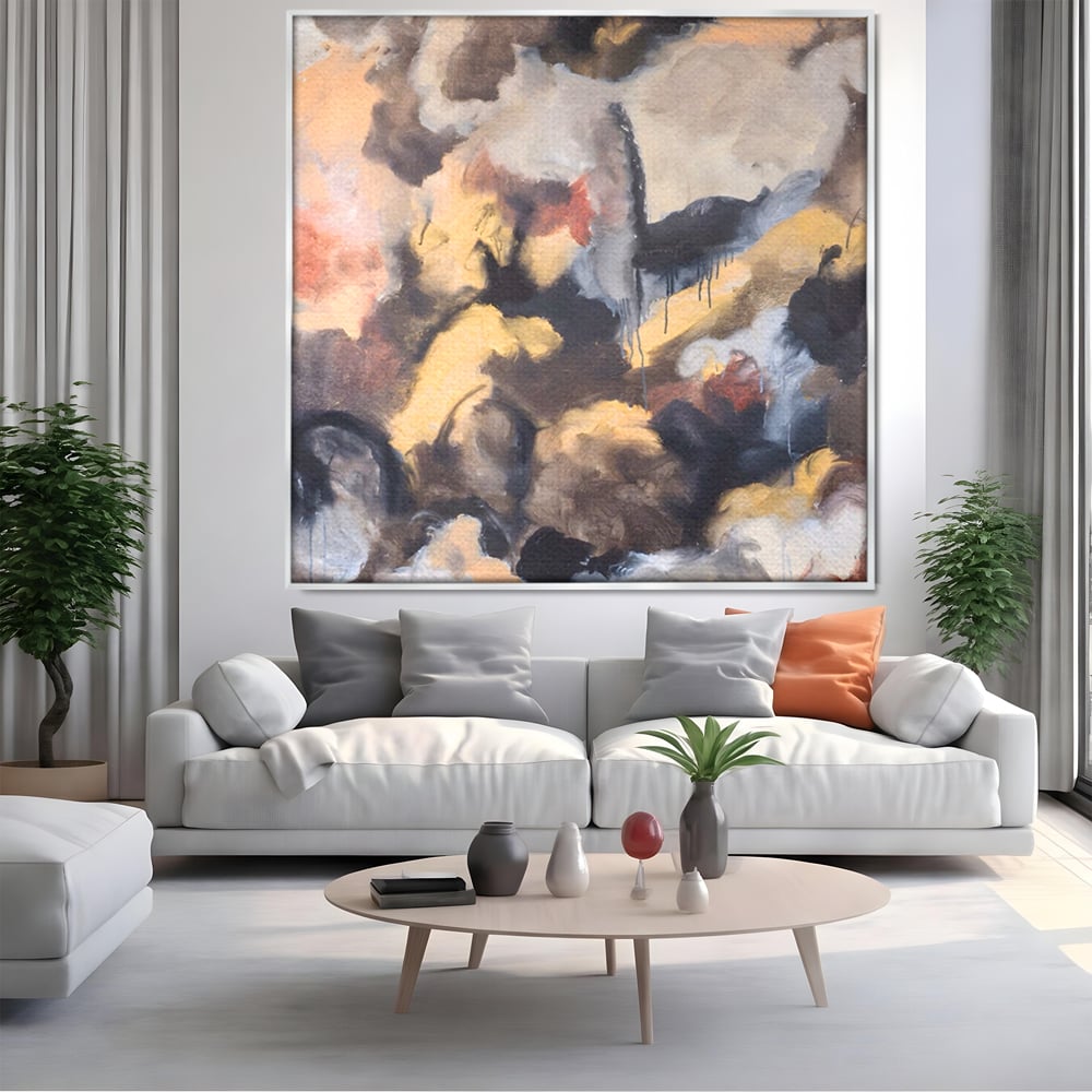 Tablou canvas cu pictura abstracta cu pete de culoare, in rama de aluminiu argintiu, pe perete intr-un living