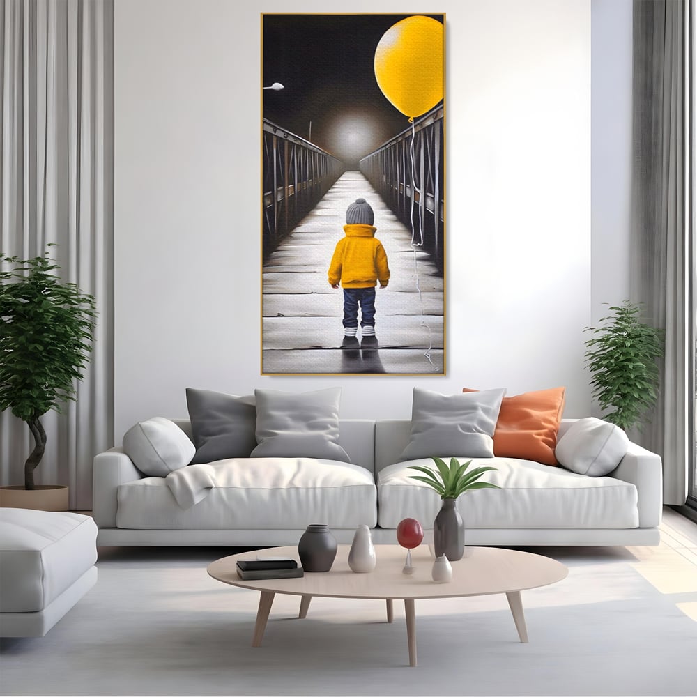 Tablou canvas cu tablou canvas cu un copil si balon galben pe pod, in rama de aluminiu auriu, pe perete intr-un living