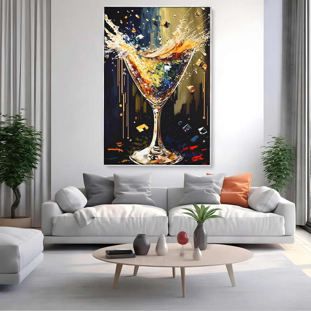 Tablou canvas cu tablou canvas cu pahar de cocktail in plina explozie de culori, in rama de aluminiu argintiu, pe perete intr-un living