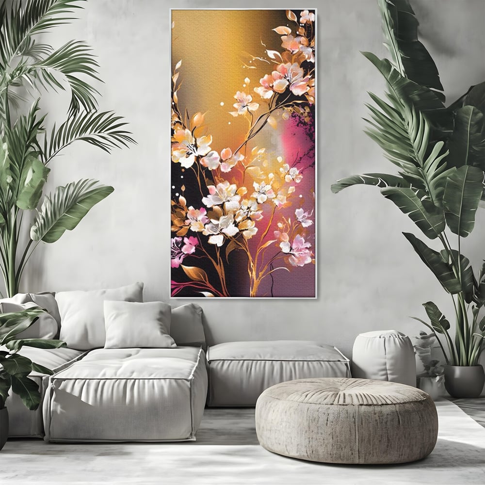 Tablou canvas cu pictura verticala cu ramura inflorita, in rama de aluminiu argintiu, pe perete intr-un living