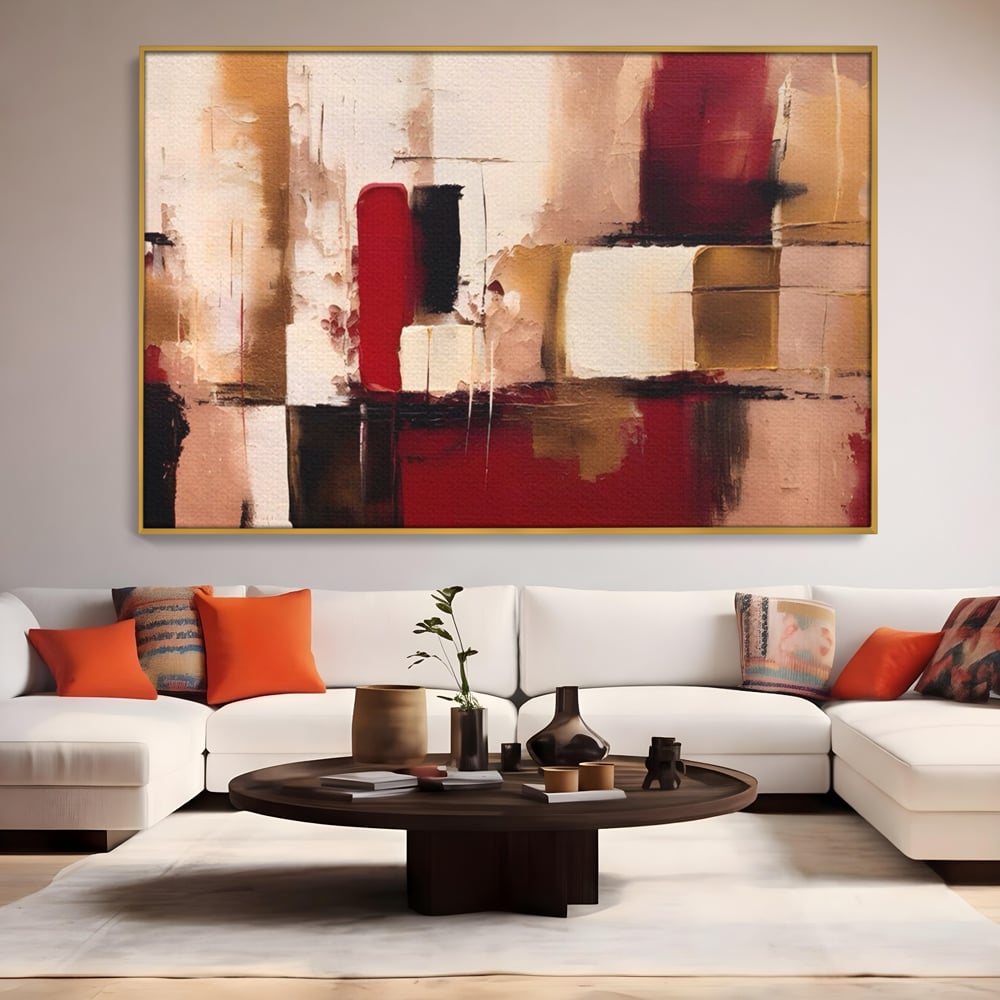 Tablou canvas cu pictura abstracta cu patrate rosii si bej, in rama de aluminiu auriu, pe perete intr-un living