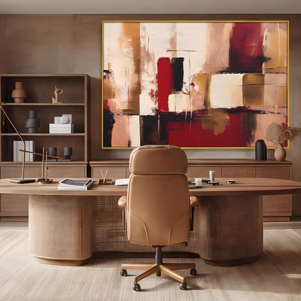 Tablou canvas cu pictura abstracta cu patrate rosii si bej, in rama de aluminiu auriu, pe perete intr-un birou