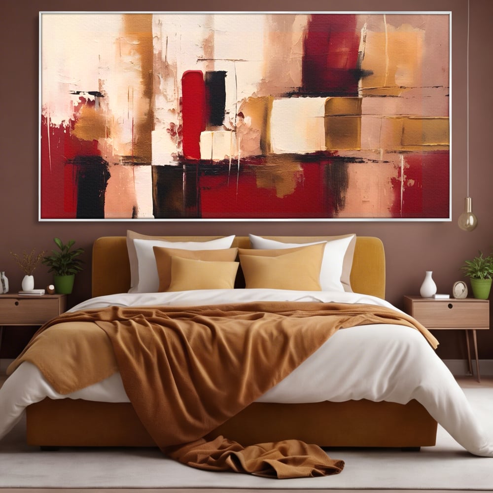 Tablou canvas cu pictura abstracta cu patrate rosii si bej, in rama de aluminiu argintiu, pe perete intr-un dormitor