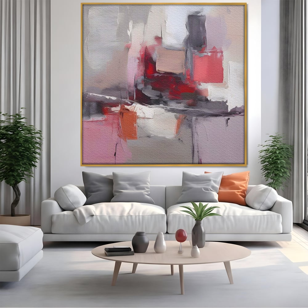 Tablou canvas cu pictura abstracta cu blocuri rosii si gri, in rama de aluminiu auriu, pe perete intr-un living