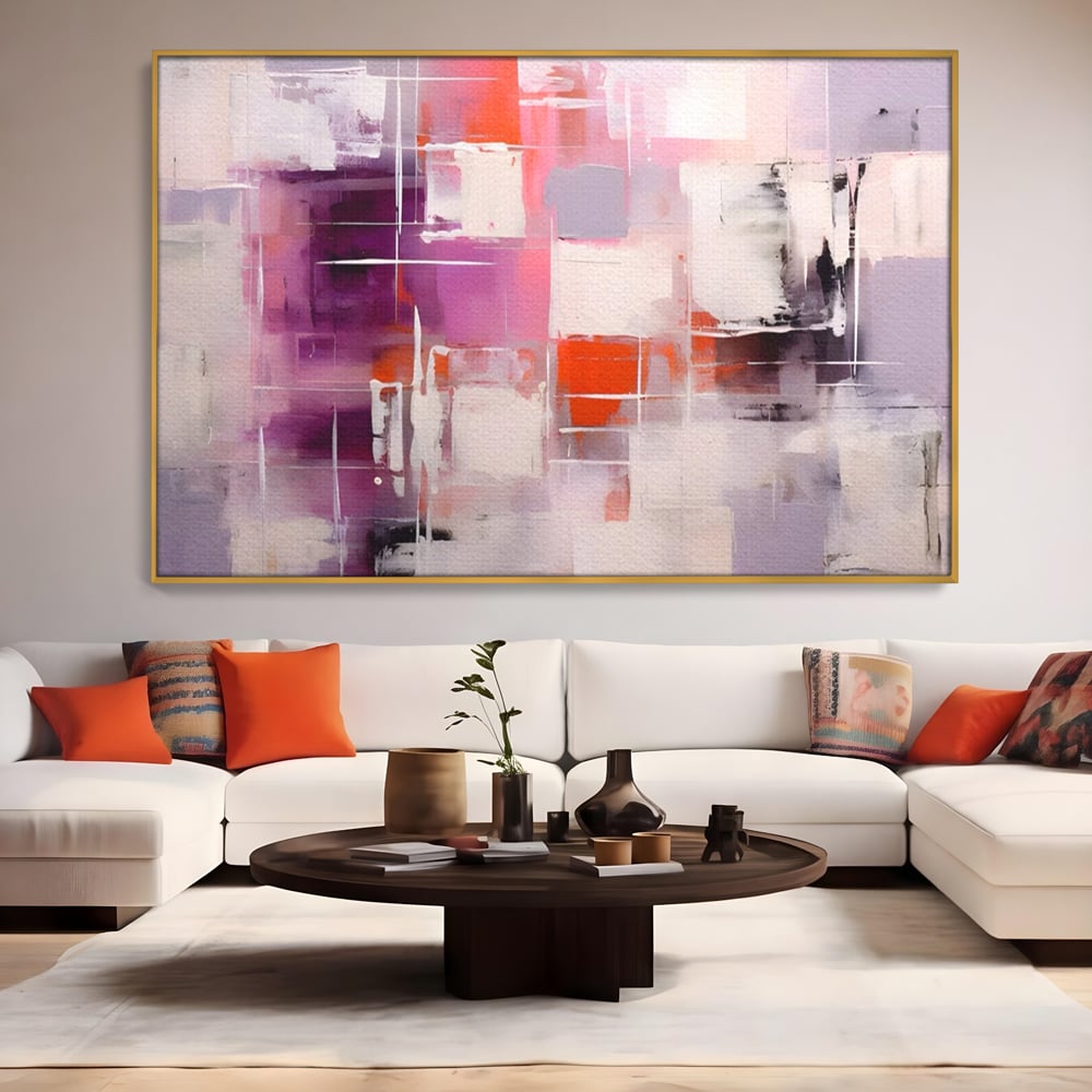Tablou canvas cu pictura abstracta cu pete mov, in rama de aluminiu auriu, pe perete intr-un living