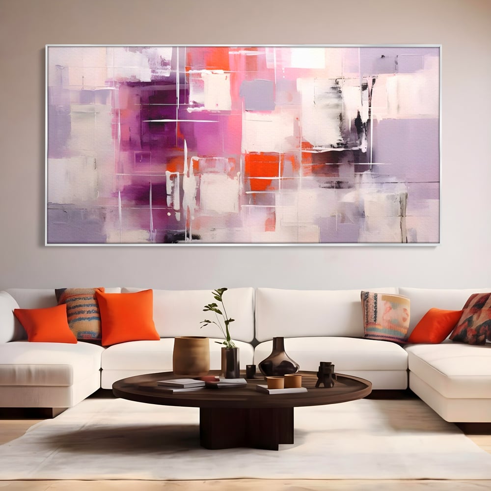 Tablou canvas cu pictura abstracta cu pete mov, in rama de aluminiu argintiu, pe perete intr-un living