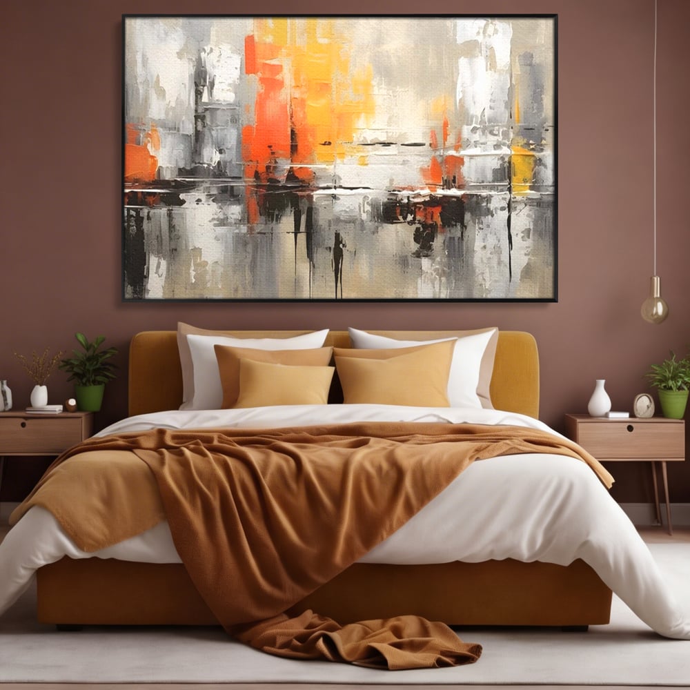 Tablou canvas cu pictura abstracta cu turnuri portocalii, in rama de aluminiu negru, pe perete intr-un dormitor