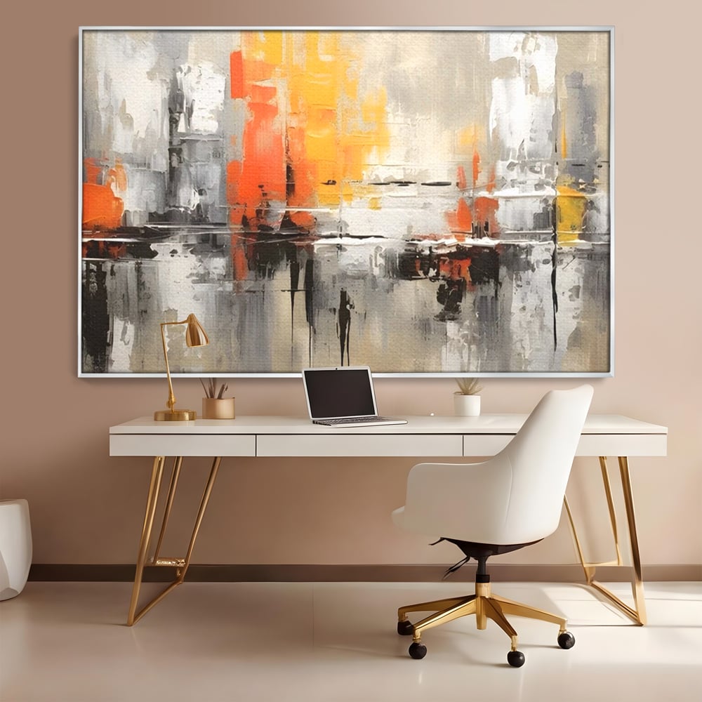 Tablou canvas cu pictura abstracta cu turnuri portocalii, in rama de aluminiu argintiu, pe perete intr-un birou