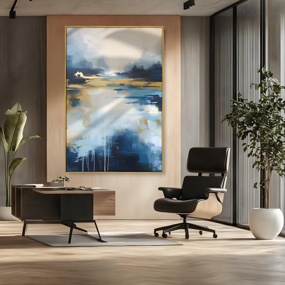 Tablou canvas cu pictura abstracta cu peisaj si cer, in rama de aluminiu auriu, pe perete intr-un birou