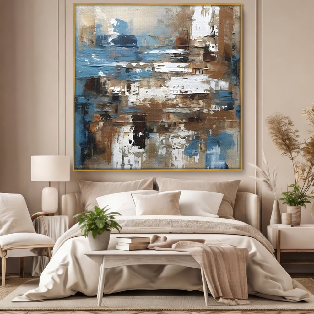Tablou canvas cu pictura abstracta cu texturi de albastru si maro, in rama de aluminiu auriu, pe perete intr-un dormitor
