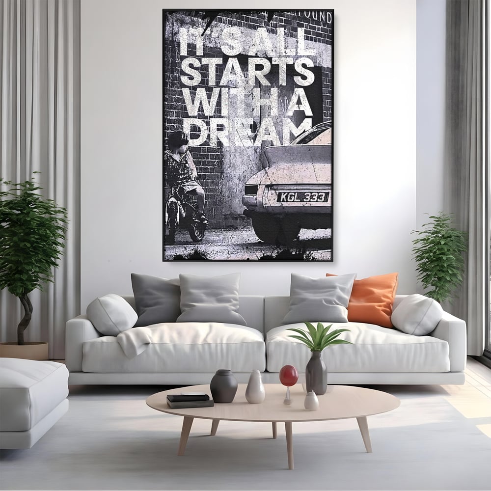 Tablou canvas cu tablou motivational alb-negru cu text si masina, in rama de aluminiu negru, pe perete intr-un living