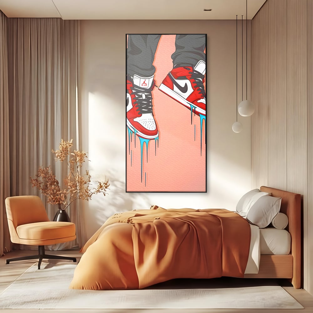 Tablou canvas cu ilustratie digitala cu adidasi rosii, in rama de aluminiu negru, pe perete intr-un dormitor