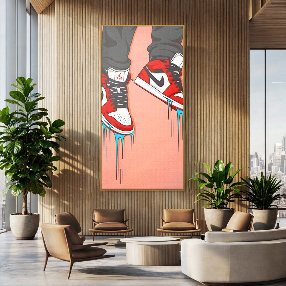 Tablou canvas cu ilustratie digitala cu adidasi rosii, in rama de aluminiu auriu, pe perete intr-un birou