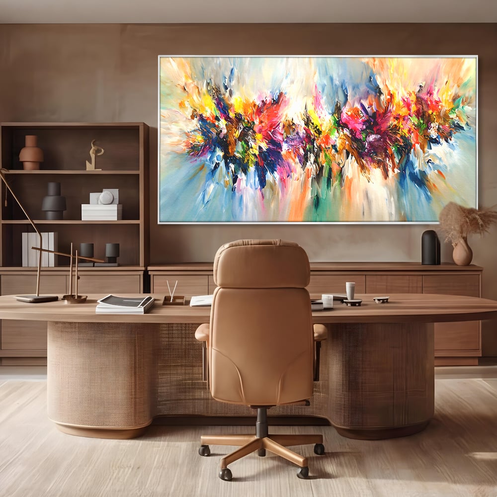 Tablou canvas cu pictura abstracta cu explozie de culoare, in rama de aluminiu argintiu, pe perete intr-un birou
