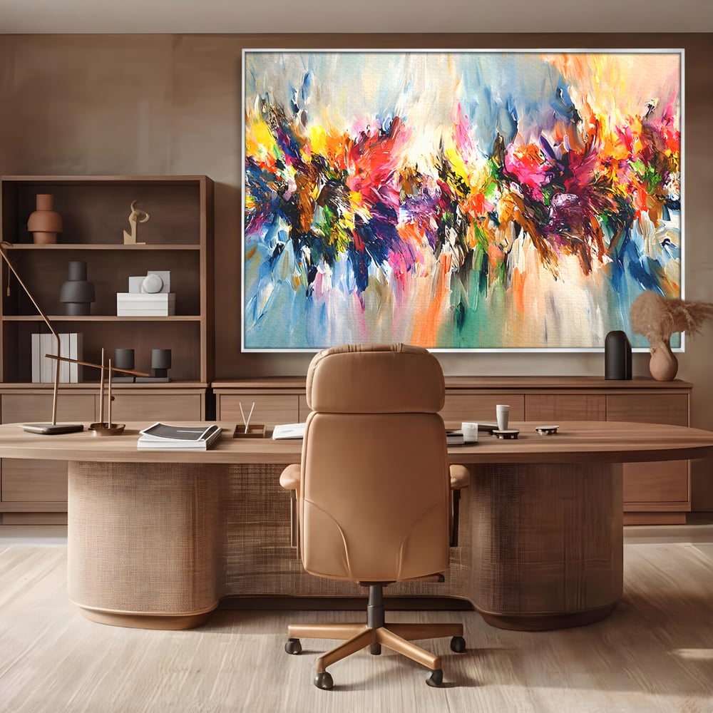 Tablou canvas cu pictura abstracta cu explozie de culoare, in rama de aluminiu argintiu, pe perete intr-un birou