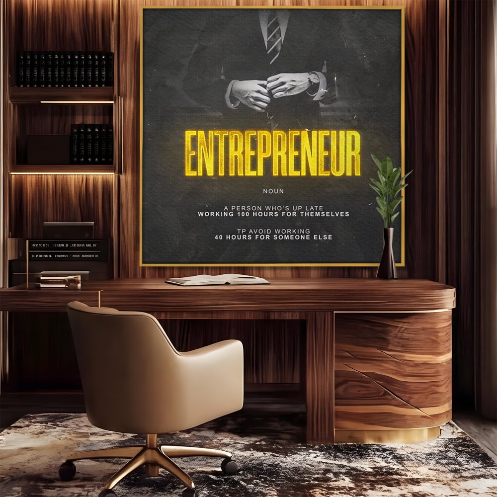 Tablou canvas cu ilustratie motivationala cu text si costum, in rama de aluminiu auriu, pe perete intr-un birou