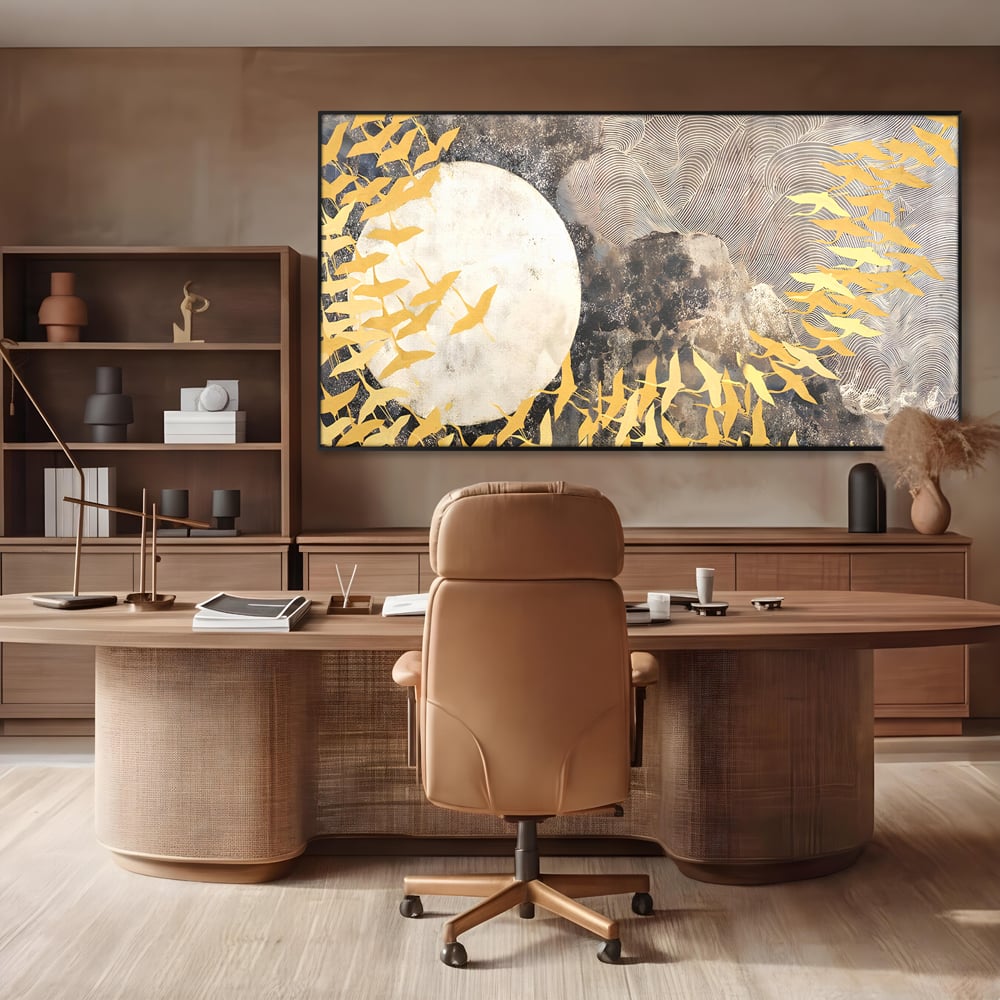 Tablou canvas cu tablou canvas cu pasari aurii si luna, in rama de aluminiu negru, pe perete intr-un birou