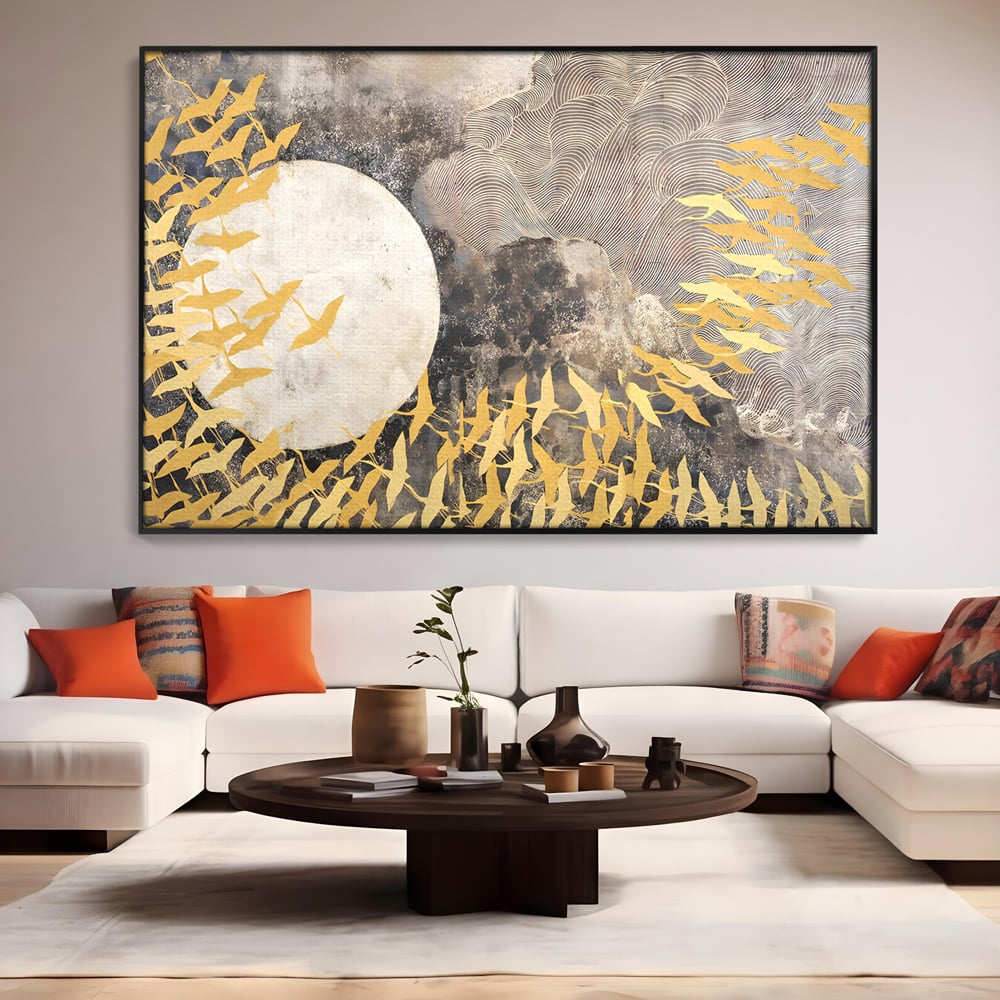 Tablou canvas cu tablou canvas cu pasari aurii si luna, in rama de aluminiu negru, pe perete intr-un living