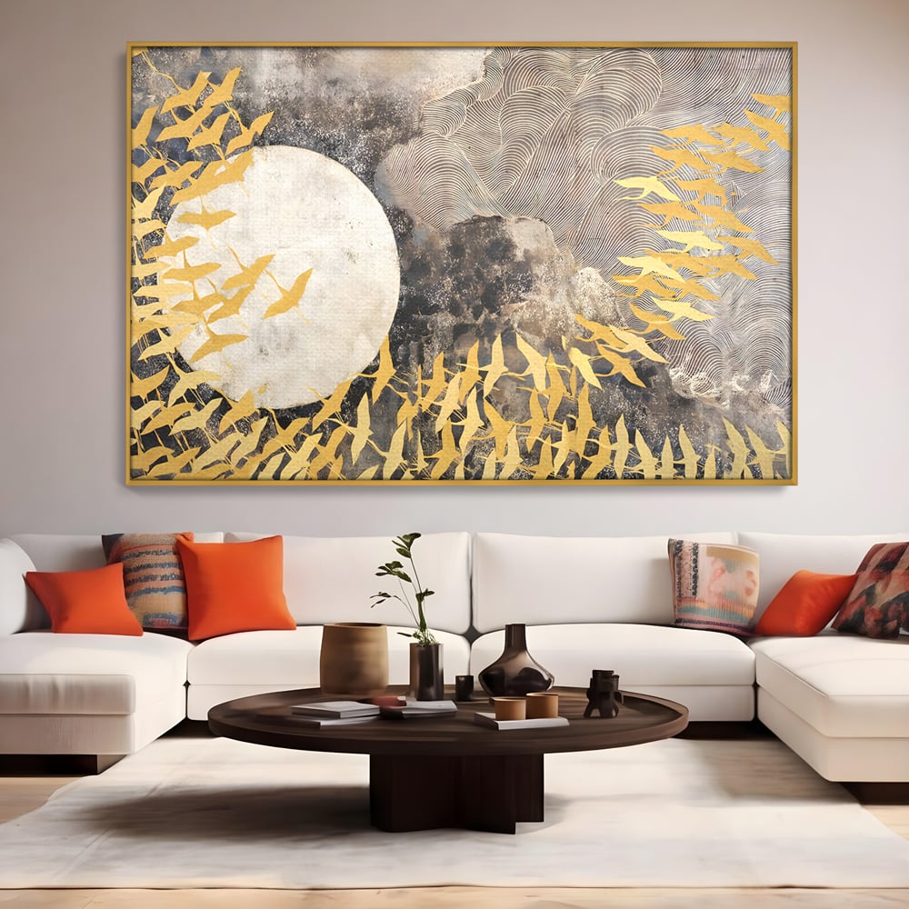Tablou canvas cu tablou canvas cu pasari aurii si luna, in rama de aluminiu auriu, pe perete intr-un living