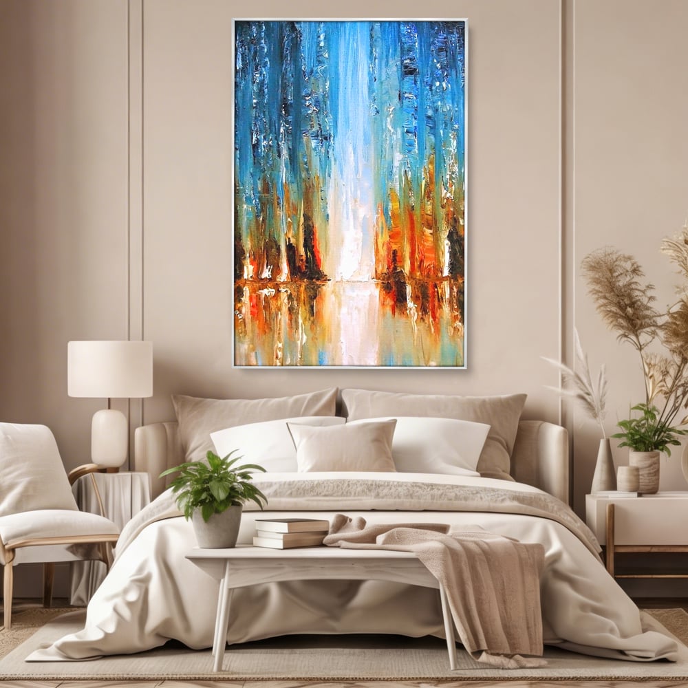 Tablou canvas cu pictura abstracta cu cascada albastra, in rama de aluminiu argintiu, pe perete intr-un dormitor