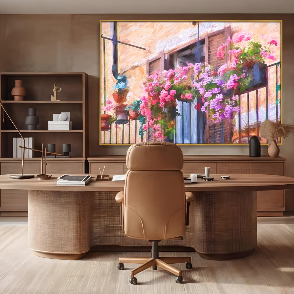 Tablou canvas cu pictura cu balcon plin de flori roz, in rama de aluminiu auriu, pe perete intr-un birou
