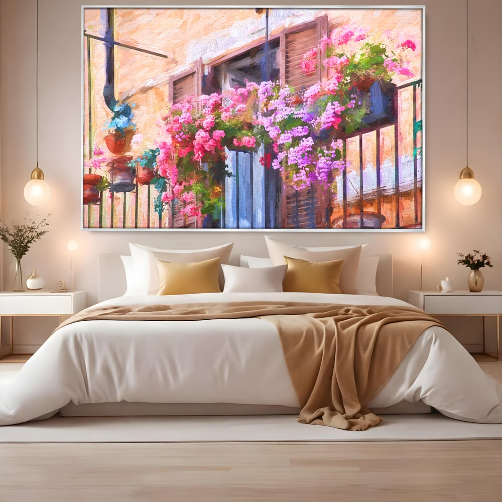 Tablou canvas cu pictura cu balcon plin de flori roz, in rama de aluminiu argintiu, pe perete intr-un dormitor