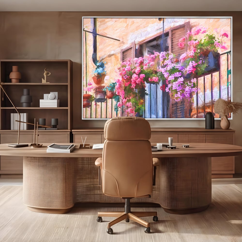 Tablou canvas cu pictura cu balcon plin de flori roz, in rama de aluminiu argintiu, pe perete intr-un birou