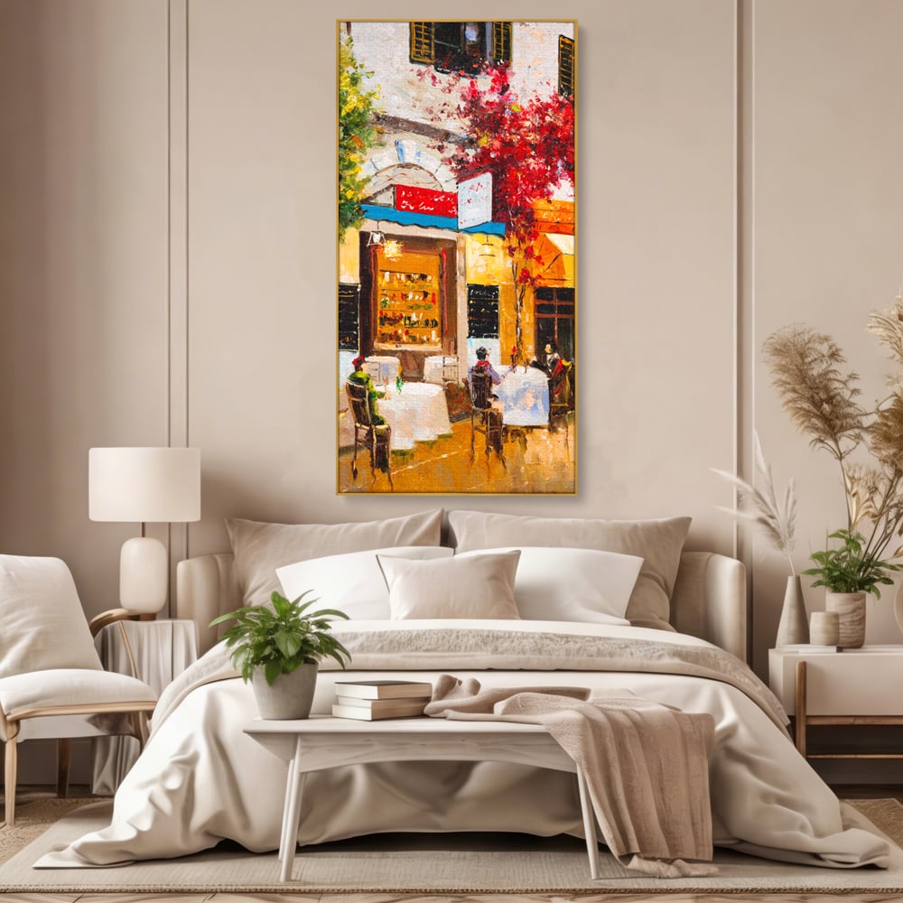 Tablou canvas cu pictura stradala cu terasa, in rama de aluminiu auriu, pe perete intr-un dormitor